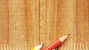 Animation of scissors and schoolbooks moving over pencils on school desk. school, education and study concept digitally generated video. - Powered by Shutterstock - Get 15% off with code: PIKWIZARD15