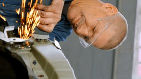 Animation of blue light moving over male caucasian mechanic using grinding tool on car in garage. Digital composite, automobile, repairing, breakdown and service occupation concept. - Powered by Shutterstock - Get 15% off with code: PIKWIZARD15