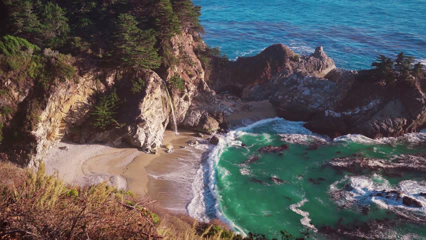 Scenic Cinemagraph of McWay Falls at Big Sur, Pfeiffer Beach, California. Beach waterfall pacific coast