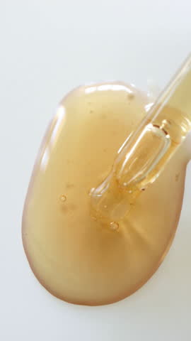 Facial serum with retinol, beauty product texture, cosmetic detail, close-up