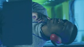 Animation of graphs, loading bars, circles, african american man checking server using laptop. Digital composite, multiple exposure, binary codes, report, business, data center, networking concept. - Powered by Shutterstock - Get 15% off with code: PIKWIZARD15