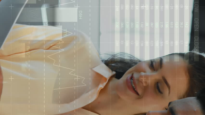 Animation of statistical data processing against diverse man and woman discussing at office. Computer interface and business data technology concept - Powered by Shutterstock - Get 15% off with code: PIKWIZARD15