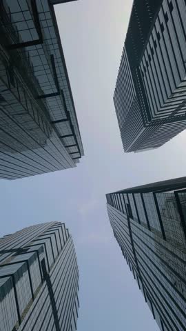 Office tall building. Low angle view of skyscrapers office building in central business district with blue sky