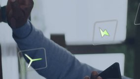 Animation of ecology icons over senior african american man using smartphone at home. Senior lifestyle, digital interface, energy, ecology, connection and communication, digitally generated video. - Powered by Shutterstock - Get 15% off with code: PIKWIZARD15