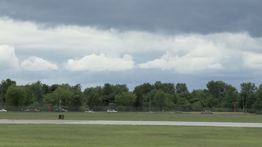 General Dynamics F-16 Fighting Falcon jet fighter landing on runway.