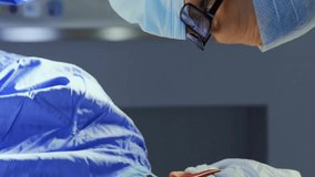 Animation of data processing over diverse surgeons during operation. Global medicine and digital interface concept digitally generated video. - Powered by Shutterstock - Get 15% off with code: PIKWIZARD15