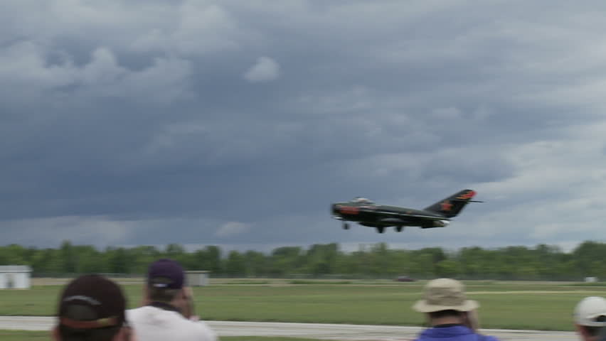 Soviet MiG-17 jet fighter landing on an airfield in the USA.  Recorded in slow