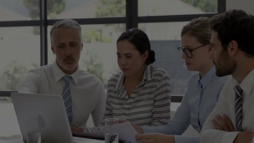 Senior executive opening laptop while team reviewing overlaid financial chart climbing dipping. Business, teamwork, collaboration, data analysis, modern, corporate, professional - Powered by Shutterstock - Get 15% off with code: PIKWIZARD15