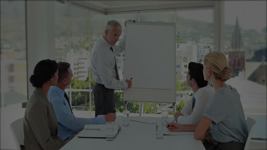 Presenter flipping sheet and drawing graph as animated chart overlay showing market trends. Business, collaboration, analytics, professional, corporate, discussion, strategy