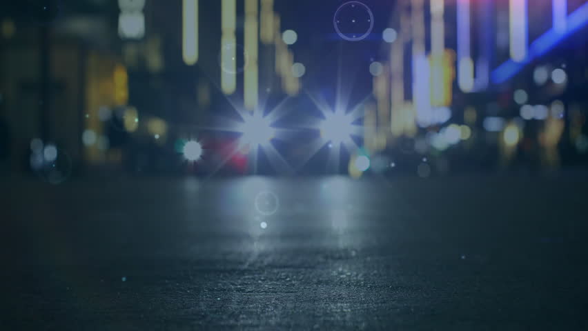 Faint rings appearing on asphalt road while particles drifting and HUD graphics scanning headlights. Technology, futurism, cyberpunk, motion graphics, digital interface, nightscape, urban environment