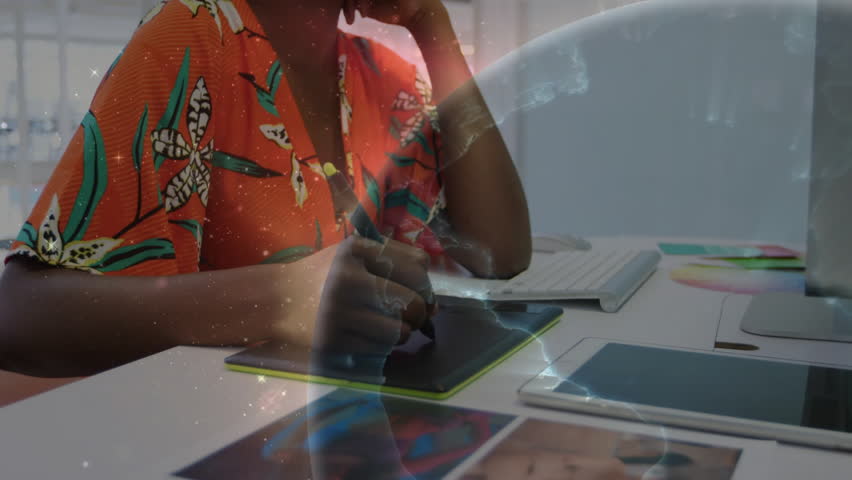 Graphic designer pressing stylus and drawing digital planet overlay while matching color swatch hue. Digital art, creativity, futuristic, innovation, workspace, inspiration, abstract - Powered by Shutterstock - Get 15% off with code: PIKWIZARD15