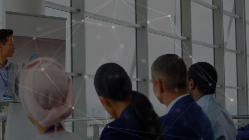 Presenter tapping remote presenting network slide in boardroom with pulsing overlay through glass. Business, technology, communication, innovation, corporate, digital, networking