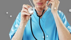 Clinician bringing stethoscope tips to ears and positioning diaphragm with drifting white circles. Healthcare, medical, professionalism, diagnostics, technology, wellness, examination - Powered by Shutterstock - Get 15% off with code: PIKWIZARD15