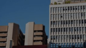 Camera capturing beige block and white high rise icons floating overlay fading showing network scan. Urban, technology, data, network, digital, skyline, minimalism - Powered by Shutterstock - Get 15% off with code: PIKWIZARD15