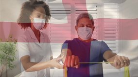 Senior man gripping yellow band and initiating therapy while physiotherapist adjusting posture. Rehabilitation, physiotherapy, elderly, health, strength, recovery, wellness - Powered by Shutterstock - Get 15% off with code: PIKWIZARD15