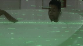 White-shirted woman moving hand toward holographic globe, animating technology data display. Futuristic, digital, interface, technology, innovation, science, visualization - Powered by Shutterstock - Get 15% off with code: PIKWIZARD15