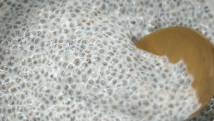 Chia pudding scoop with spoon, close up