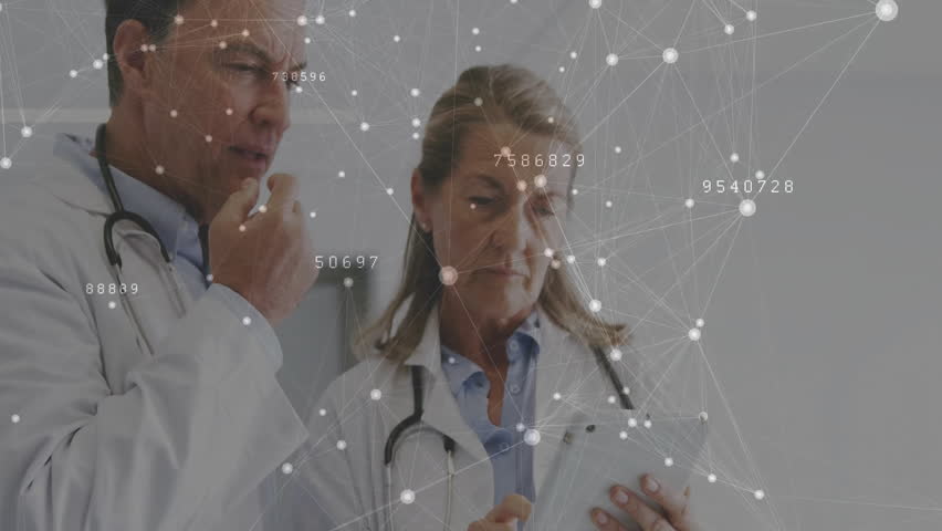 Female physician tapping tablet and male physician pointing data overlay while reviewing records. Professional, collaboration, digital, healthcare, technology, science, analytics - Powered by Shutterstock - Get 15% off with code: PIKWIZARD15
