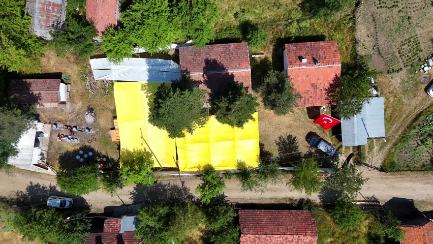 Aerial 4K footage of a traditional rain prayer and keşkek festival in Kurtlu Village, Boyabat, Sinop, Turkey. Local culture, people, and rural life captured from above during the vibrant ceremony