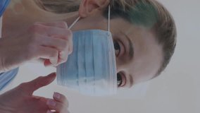 Animation of data processing over caucasian woman with face mask. Global business and digital interface concept digitally generated video. - Powered by Shutterstock - Get 15% off with code: PIKWIZARD15