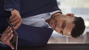 Animation of data processing and diagrams with globes over businessman using tablet. Global business and digital interface concept digitally generated video. - Powered by Shutterstock - Get 15% off with code: PIKWIZARD15