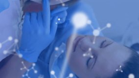 Animation of molecules over caucasian male and female dentists and girl patient. Global medicine, healthcare and digital interface concept digitally generated video. - Powered by Shutterstock - Get 15% off with code: PIKWIZARD15