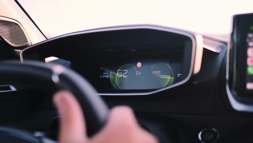 Dynamic close up footage of electronic dash indicators as vehicle accelerates to 152 kmh in sport mode