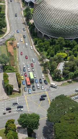 SINGAPORE - 13 MARCH 2025 : timelapse of traffic street scene in singapore in vertical