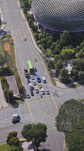 SINGAPORE - 13 MARCH 2025 : timelapse of traffic street scene in singapore in vertical