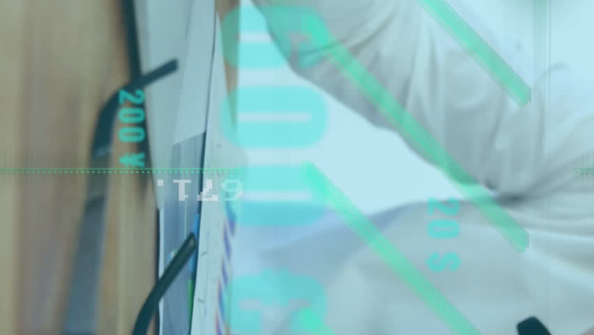 In office, businessman analyzing financial data with animation overlaying workspace. analytics, corporate, finance, technology, digital, innovation - Powered by Shutterstock - Get 15% off with code: PIKWIZARD15