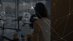 Businesswoman typing on laptop at café table initiating animated data feed for live analytics. Professional, urban, modern, technology, networking, data, connectivity - Powered by Shutterstock - Get 15% off with code: PIKWIZARD15