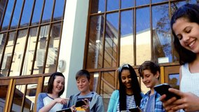 five youths tapping devices at glass doors, initiating social media icons showing on smartphones. Teenagers, technology, social media, connectivity, youth culture, digital interaction, urban - Powered by Shutterstock - Get 15% off with code: PIKWIZARD15