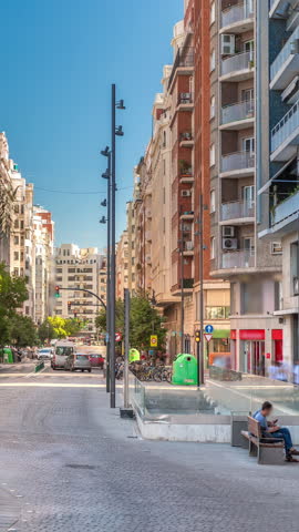 Traffic passes near a bus stop close to Valencia Central Market on avenue de l