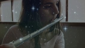 Teenage girl raising silver flute and warming up while sparkling overlay following finger movements. Musician, rehearsal, elegance, ambient, concentration, artistic, serenity - Powered by Shutterstock - Get 15% off with code: PIKWIZARD15