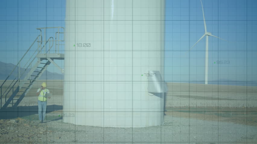 Engineer ending call at wind turbine base while scanning tower and monitoring realtime data overlay. Industrial, technology, analytics, energy, productivity, innovation, precision - Powered by Shutterstock - Get 15% off with code: PIKWIZARD15