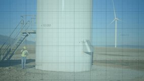 Engineer ending call at wind turbine base while scanning tower and monitoring realtime data overlay. Industrial, technology, analytics, energy, productivity, innovation, precision - Powered by Shutterstock - Get 15% off with code: PIKWIZARD15