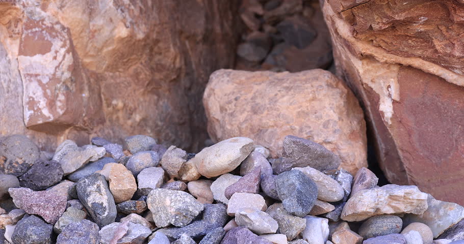 Closeup stone and rock surfaces reveal by slider pull back movement 
