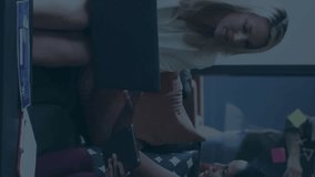 Animation of statistical data processing over two diverse female colleagues discussing at office. Business data technology concept - Powered by Shutterstock - Get 15% off with code: PIKWIZARD15