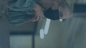 Animation of digital icons over african american male receptionist talking to caucasian woman. Business technology and covid-19 pandemic technology concept - Powered by Shutterstock - Get 15% off with code: PIKWIZARD15