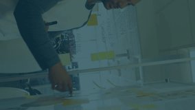 Animation of multiple graphs with changing numbers over diverse coworkers sharing ideas in office. Digital composite, multiple exposure, report, business, growth, teamwork and planning concept. - Powered by Shutterstock - Get 15% off with code: PIKWIZARD15