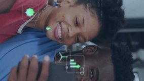 Animation of eco icons and data processing over happy african american couple using smarthopne. Global green energy, connections, computing and data processing concept digitally generated video. - Powered by Shutterstock - Get 15% off with code: PIKWIZARD15