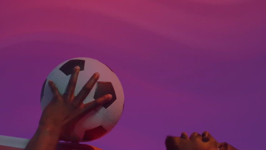 Animation of charts processing data over african american male footballer holding ball on purple. Network, data, sport, competition, digital interface and communication, digitally generated video. - Powered by Shutterstock - Get 15% off with code: PIKWIZARD15