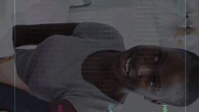 Animation of colourful cardiographs over happy diverse patient and doctor taking pressure. Medicine, health and digital interface concept, digitally generated video. - Powered by Shutterstock - Get 15% off with code: PIKWIZARD15