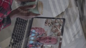 Animation of infographic interface over caucasian woman video calling with senior man on laptop. Digital composite, family, love, talking, technology, graphs, report, business, coffee cup. - Powered by Shutterstock - Get 15% off with code: PIKWIZARD15