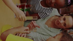 Animation of data processing over diverse group of students and teacher. Global education technology data processing and connections concept digitally generated video. - Powered by Shutterstock - Get 15% off with code: PIKWIZARD15