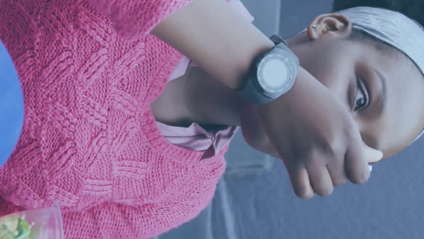 Animation of media icons over african american woman having lunch in city. Social media and digital interface concept digitally generated video. - Powered by Shutterstock - Get 15% off with code: PIKWIZARD15