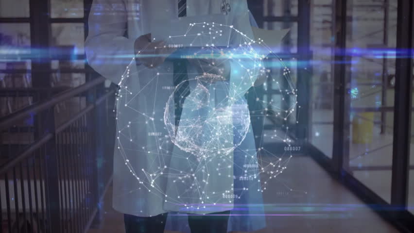 Doctor scrolling tablet in hospital causing rotating hologram showing data with colleague observing. Medical, technology, futuristic, innovation, clinical, analysis, healthcare