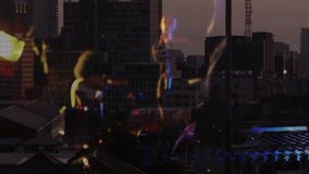 woman strumming guitar on rooftop creating glowing beams floating notes boosting music performance. Concert, live performance, stage, nightlife, atmospheric, modern, urban - Powered by Shutterstock - Get 15% off with code: PIKWIZARD15