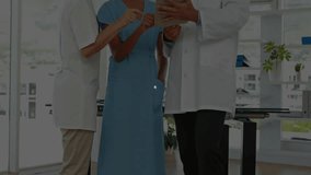 Nurse holding tablet starting network visualization as doctors pointing and analyzing clinical data. Medical team, collaboration, innovation, digital interface, health technology, professional, - Powered by Shutterstock - Get 15% off with code: PIKWIZARD15