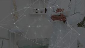 Network overlay sweeping screen revealing doctor writing notes for digital health consultation. Medical, healthcare, technology, innovation, diagnosis, communication, professionalism - Powered by Shutterstock - Get 15% off with code: PIKWIZARD15